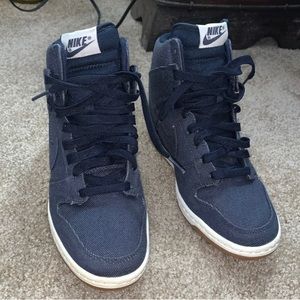 Blue heeled Nike shoes